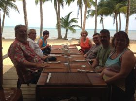 Belize expats at a table by the ocean – Best Places In The World To Retire – International Living